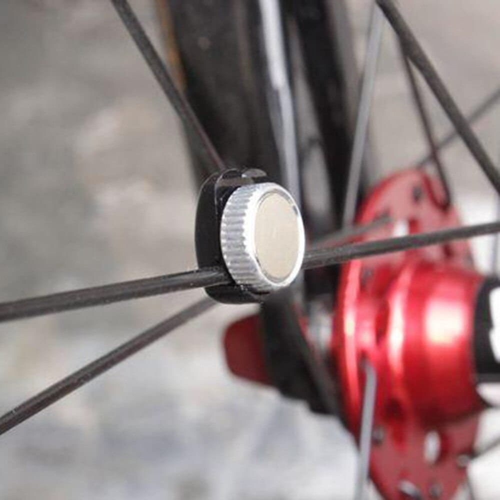 Speed sensor magnet on the front wheel of a bicycle
